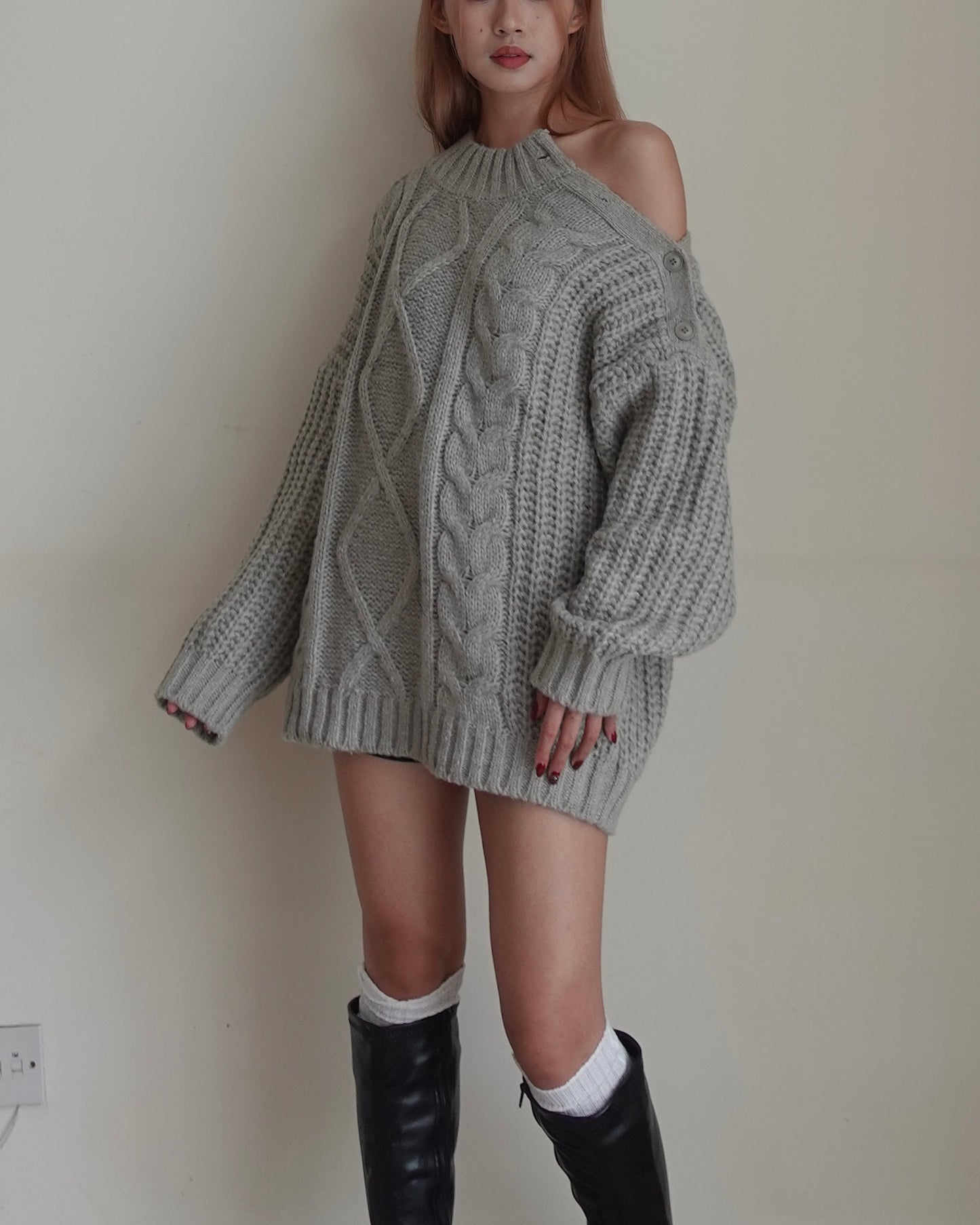 Cold shoulder cable sweater