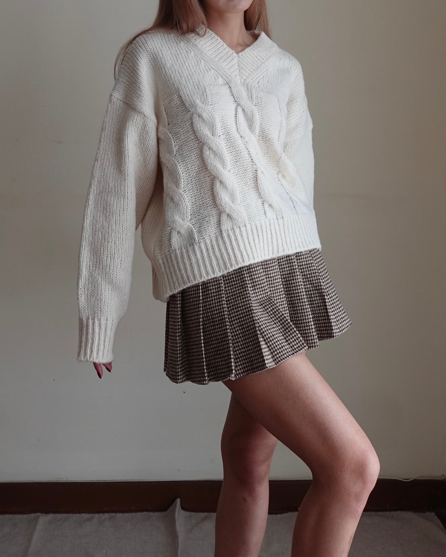 Houndstooth pleated mini skirt with belt