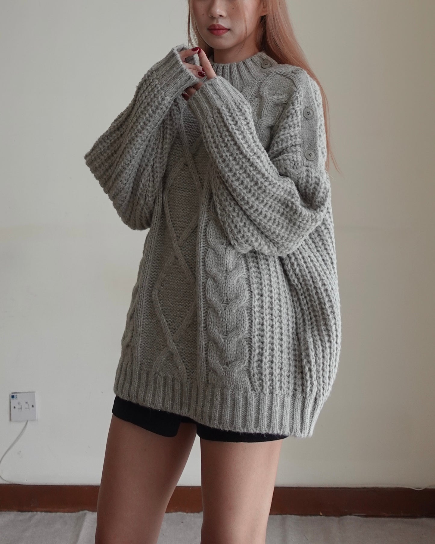 Cold shoulder cable sweater
