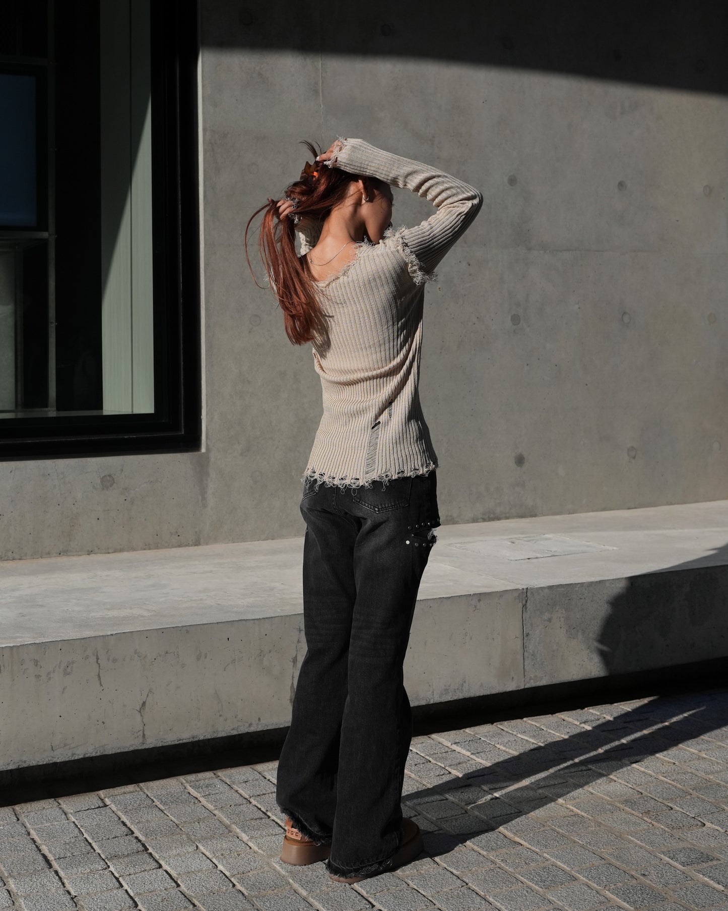 V-neck distressed knit top