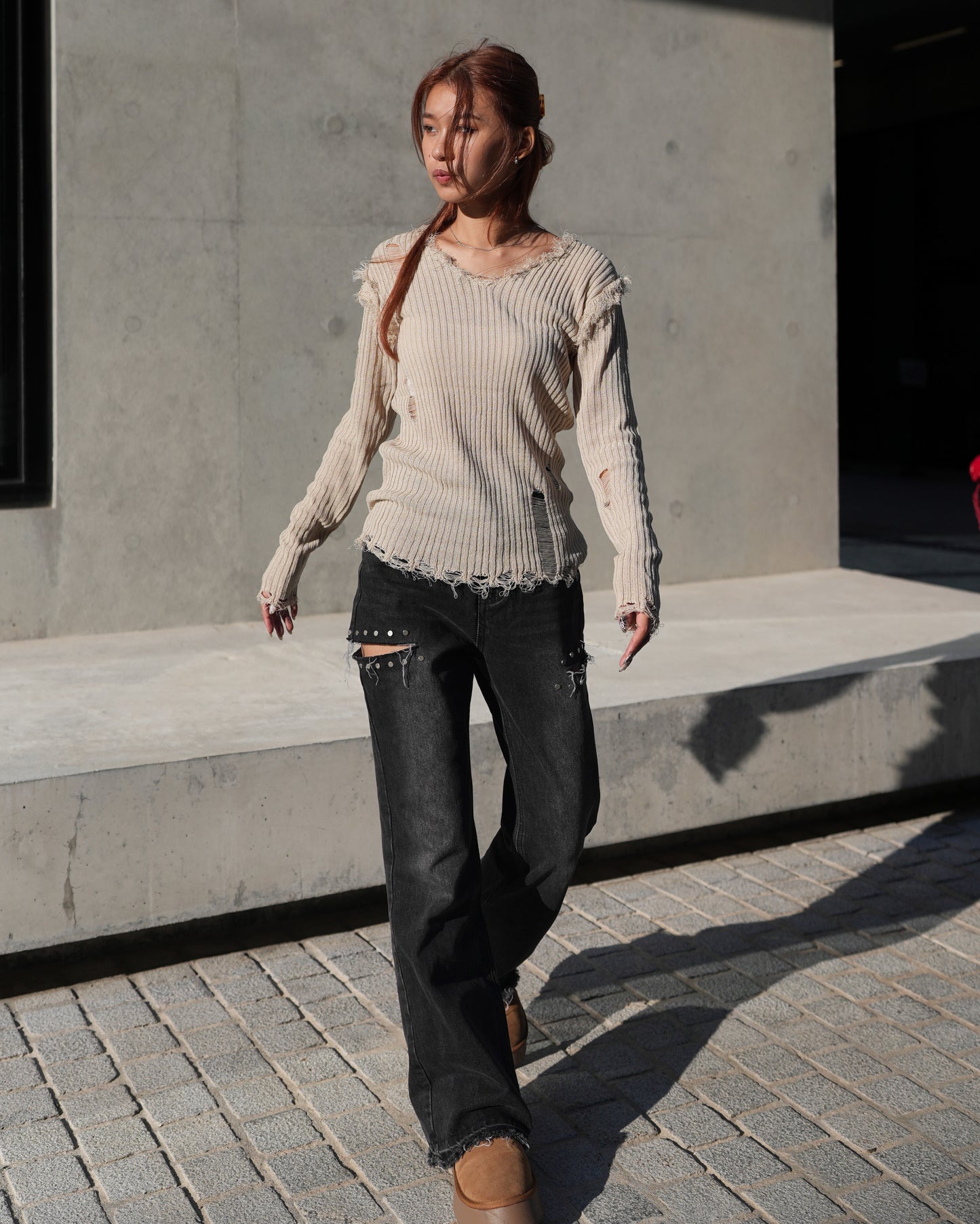 V-neck distressed knit top