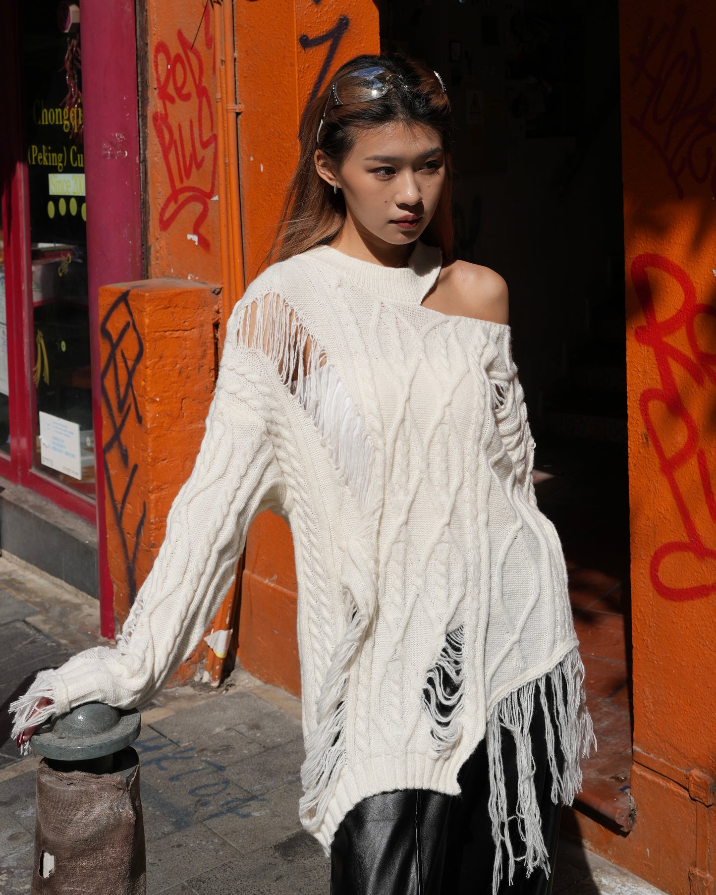 Cut out cable distressed sweater