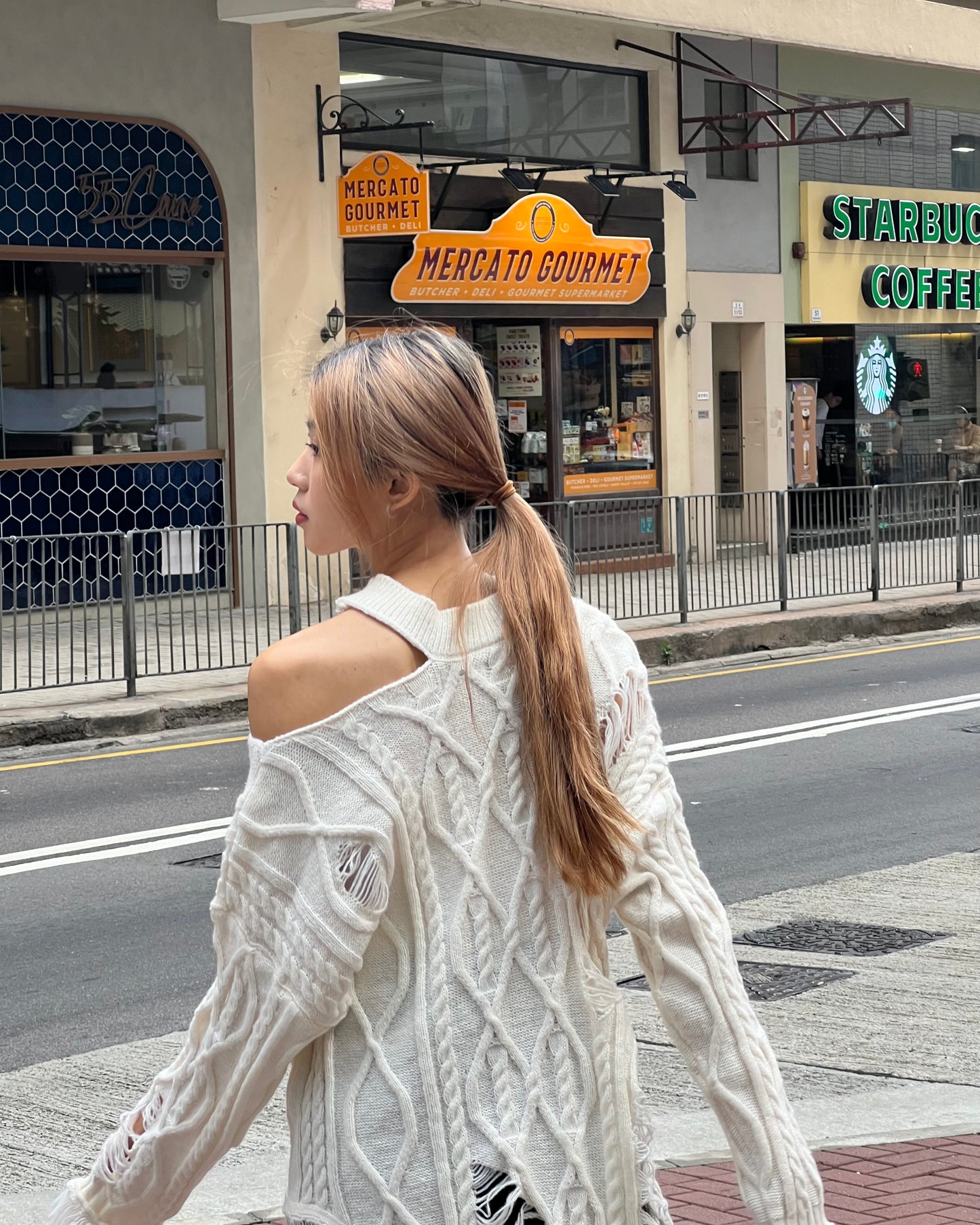 Cut out cable distressed sweater