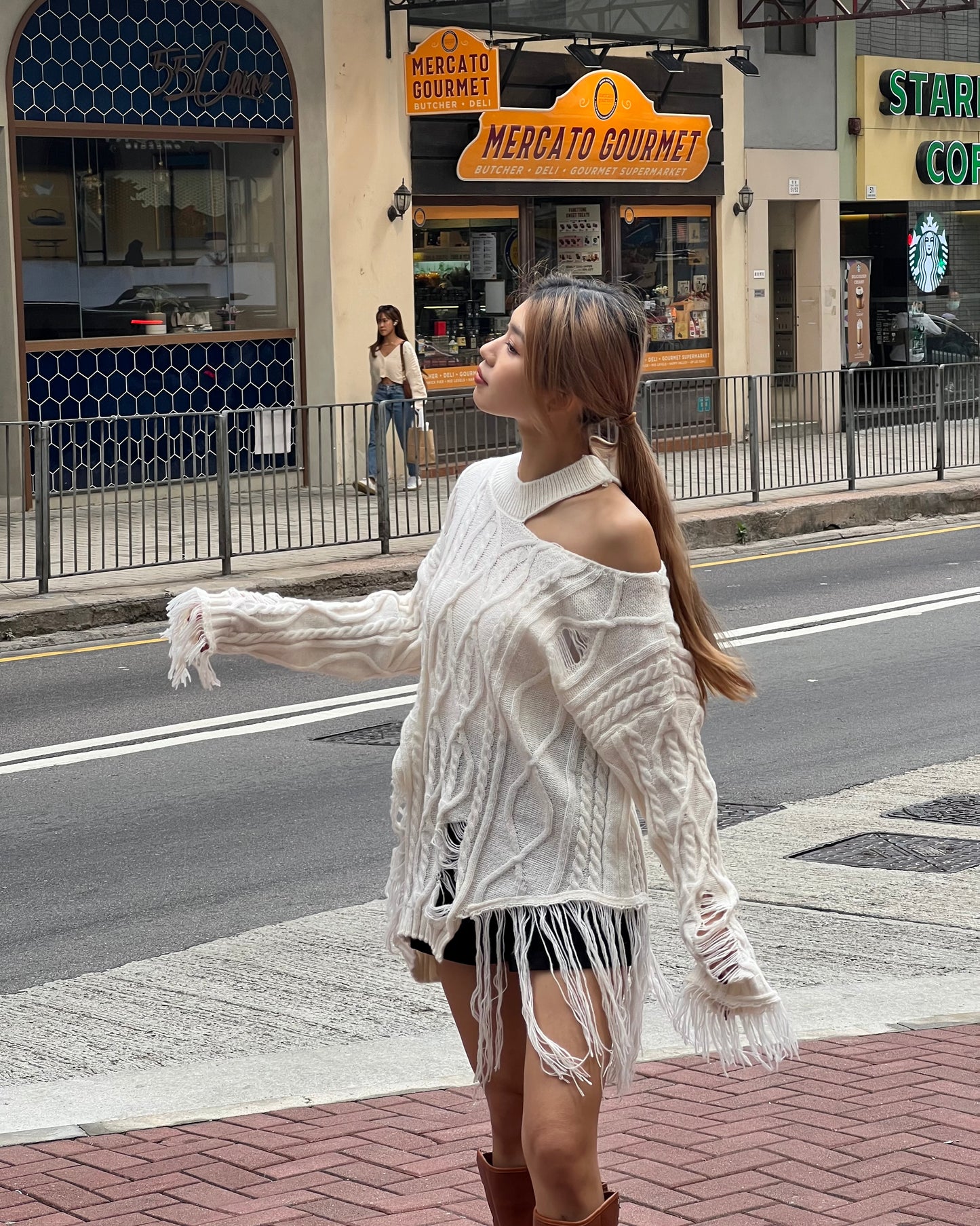 Cut out cable distressed sweater