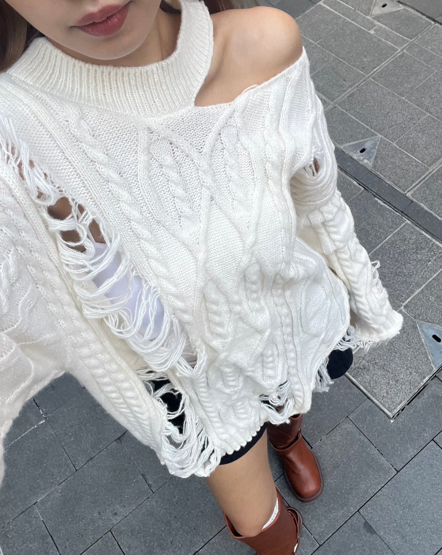 Cut out cable distressed sweater
