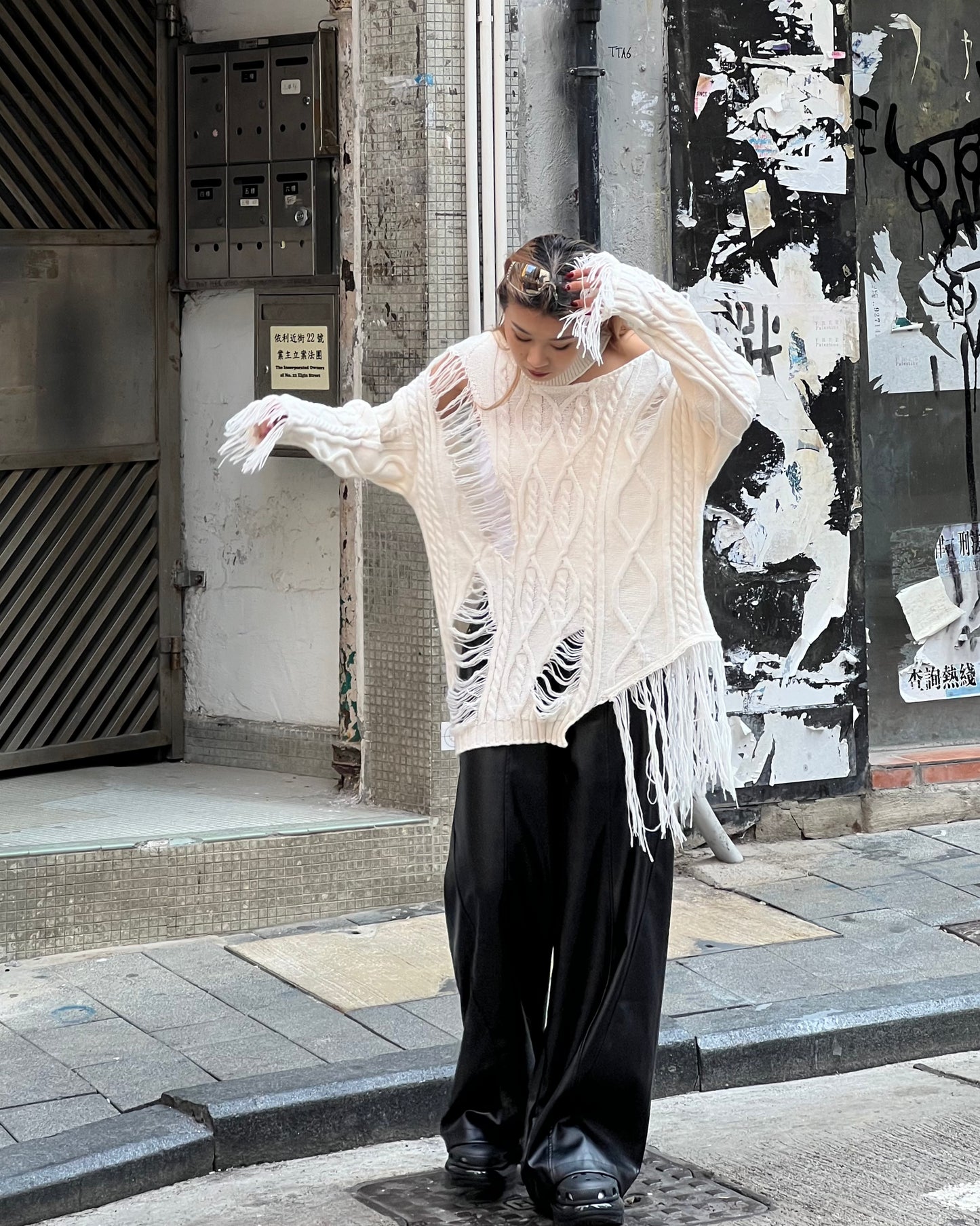 Cut out cable distressed sweater