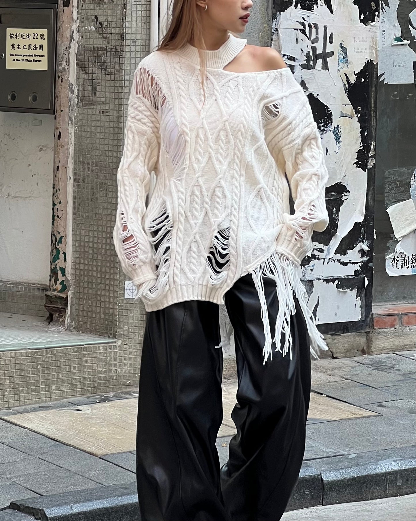 Cut out cable distressed sweater