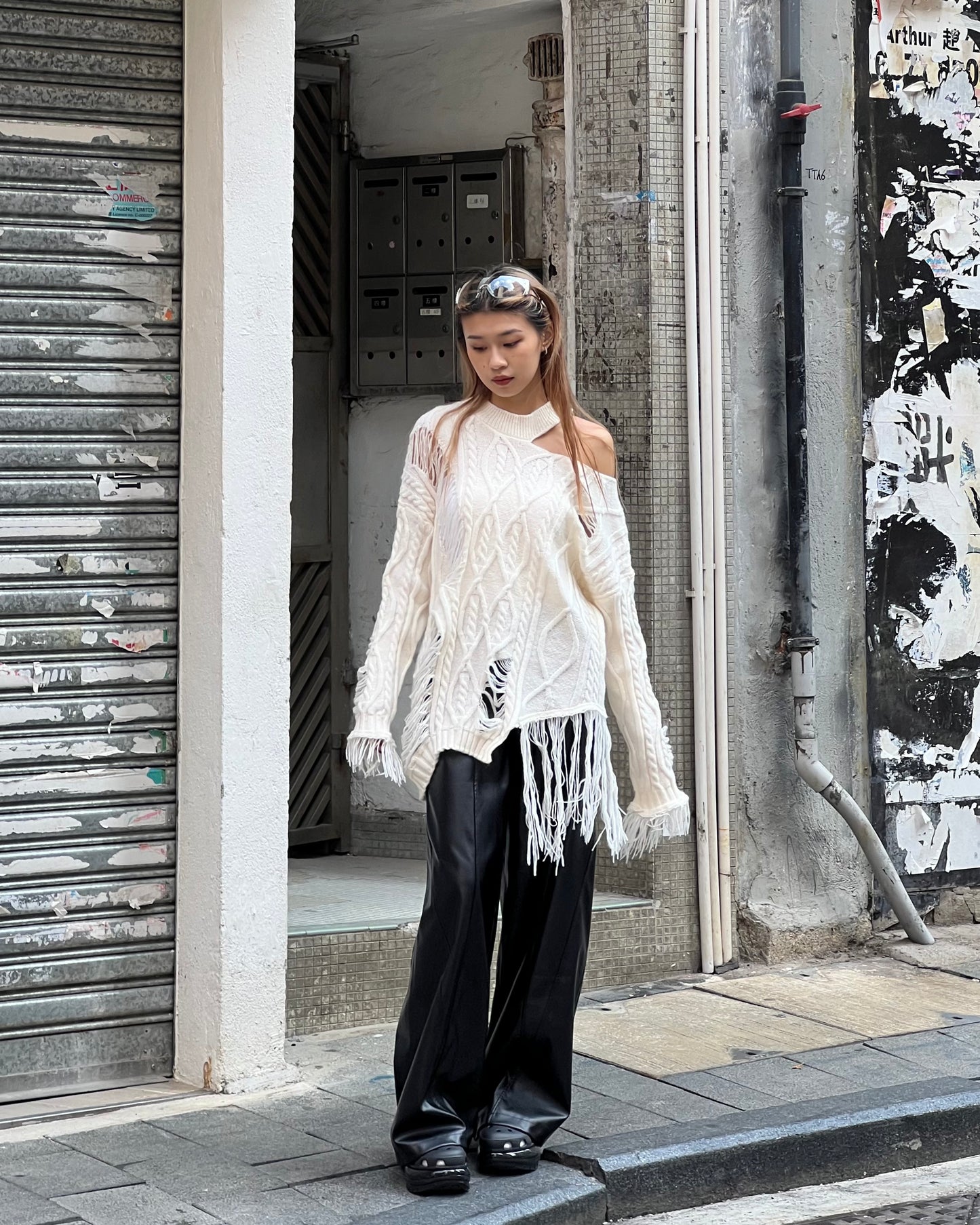 Cut out cable distressed sweater