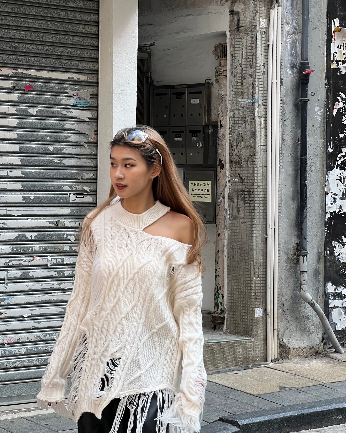 Cut out cable distressed sweater