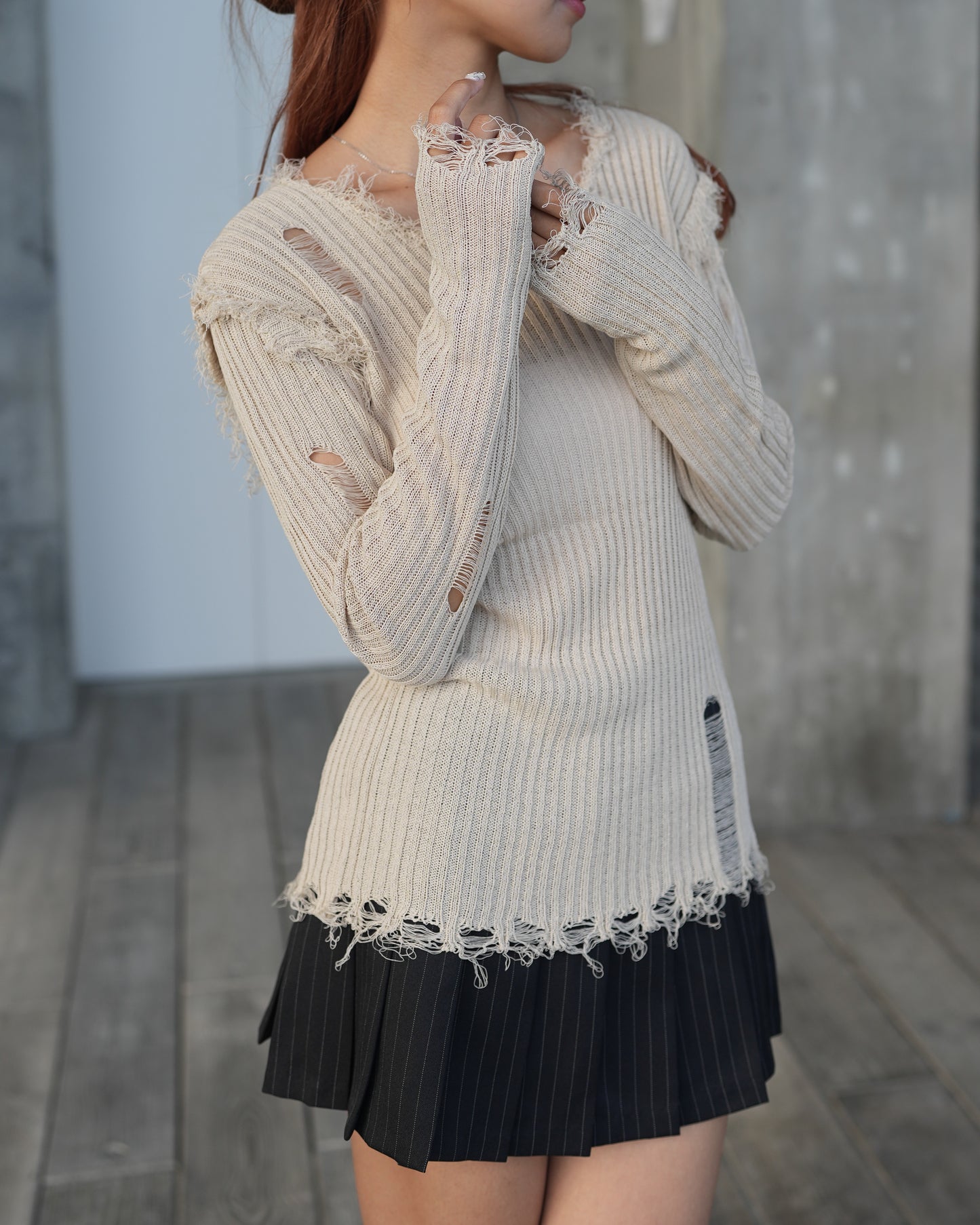 V-neck distressed knit top