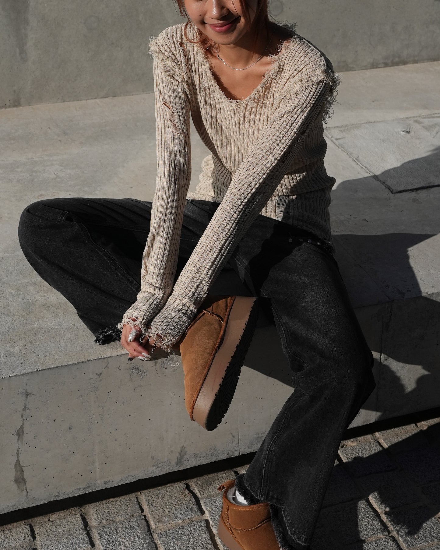 V-neck distressed knit top