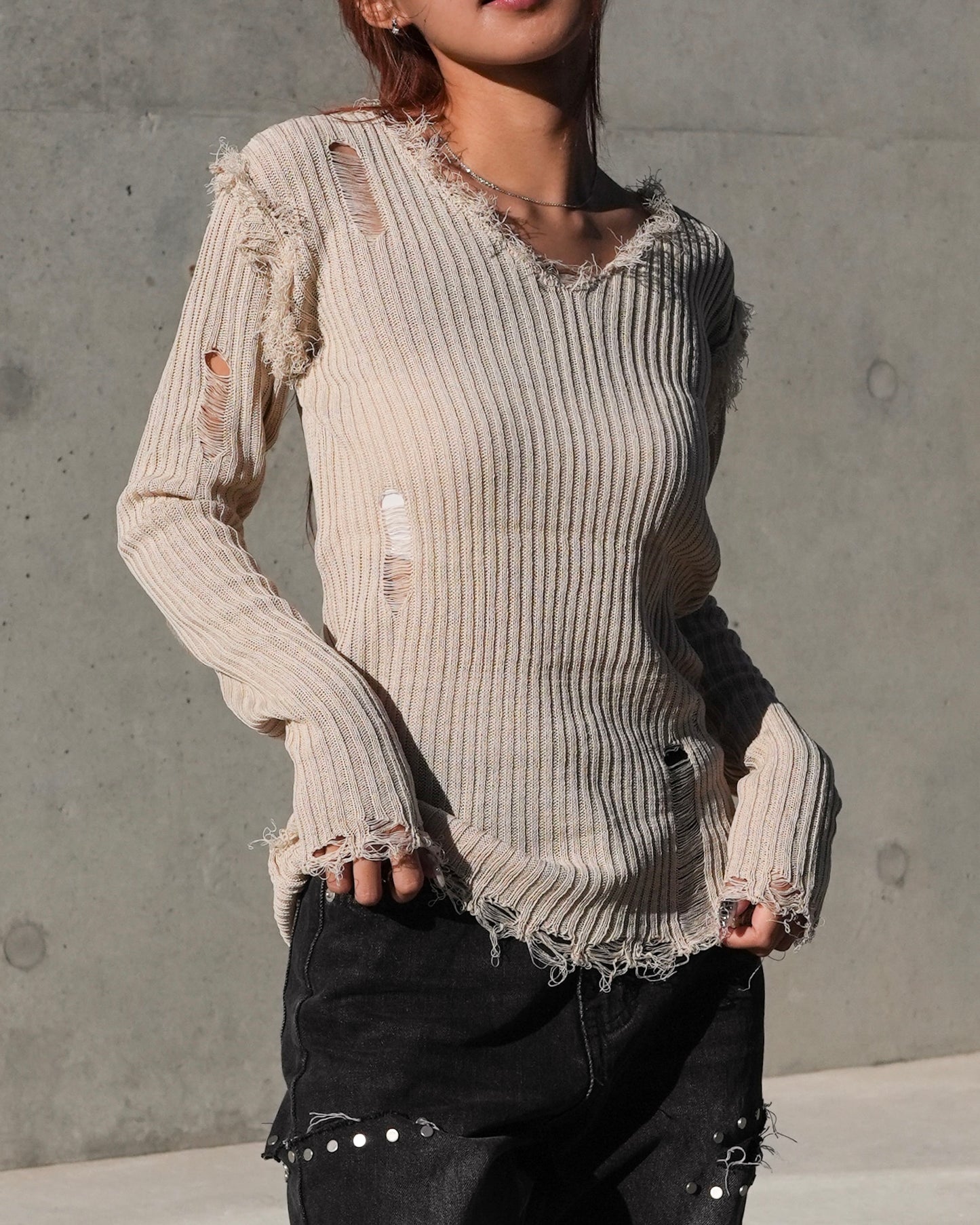 V-neck distressed knit top